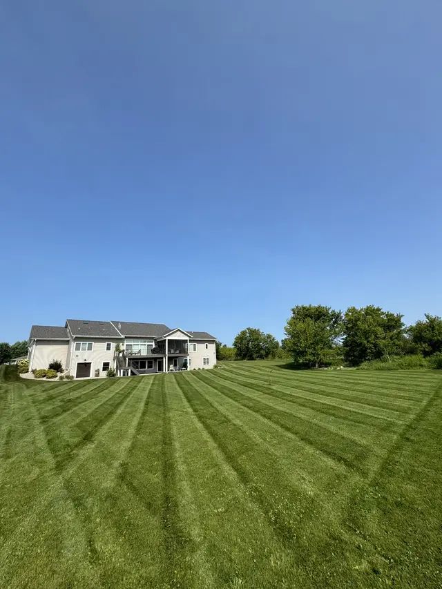Large striped lawn in front of a house