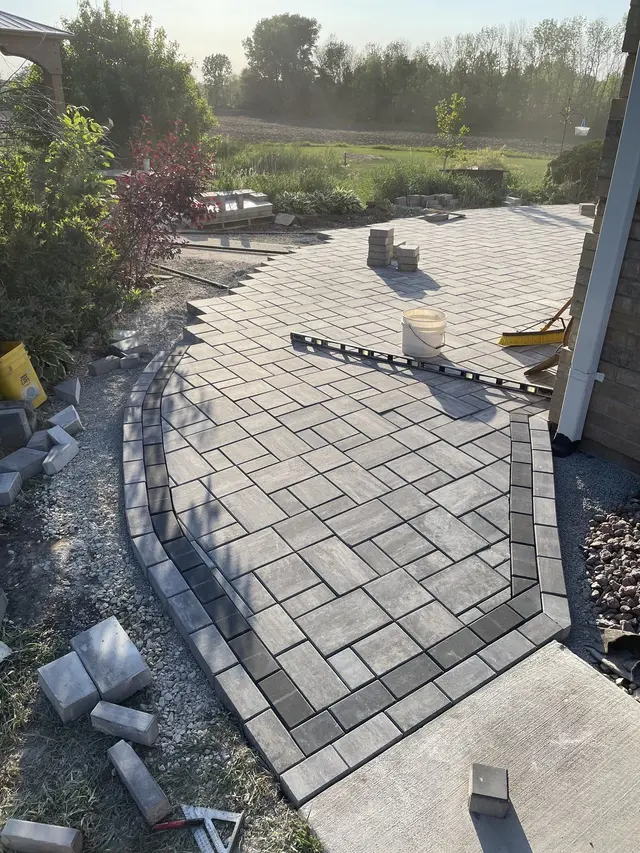 Paver patio and walkway with a border
